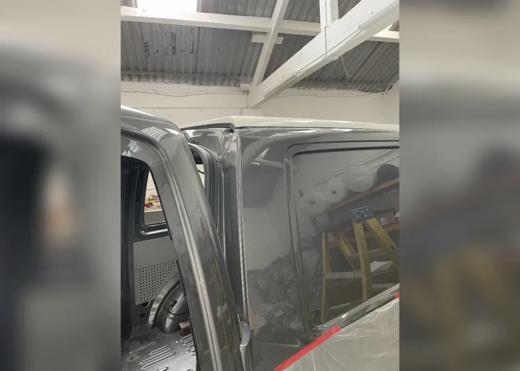 Close-up of a grey camper van showing detailed craftsmanship during a custom camper conversion in Manchester