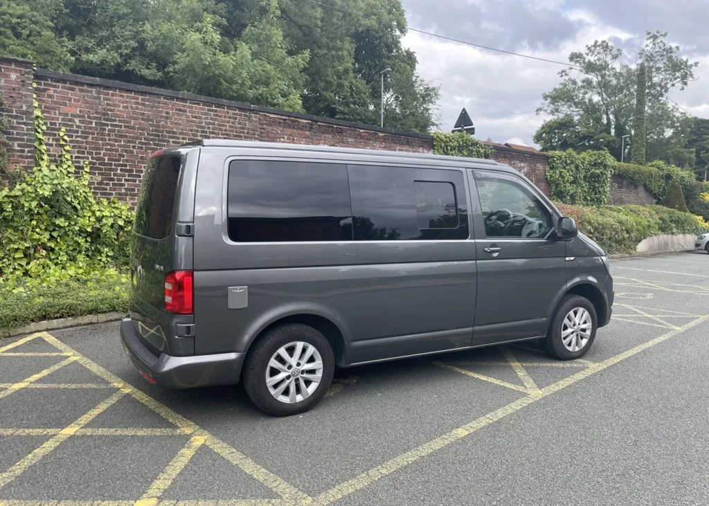 Rear side view of a grey camper van, showcasing sleek design as part of custom camper conversion projects in Manchester