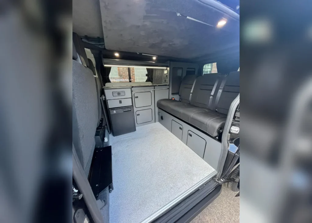 Camper van interior with storage and seats