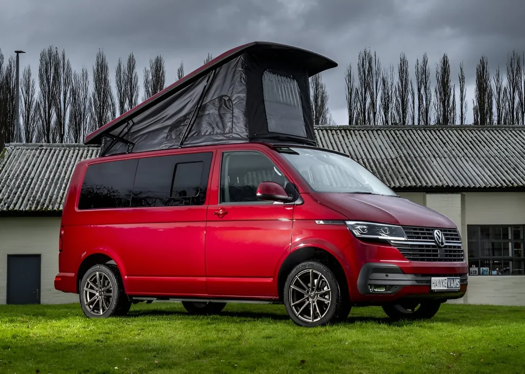 Red camper van with raised roof