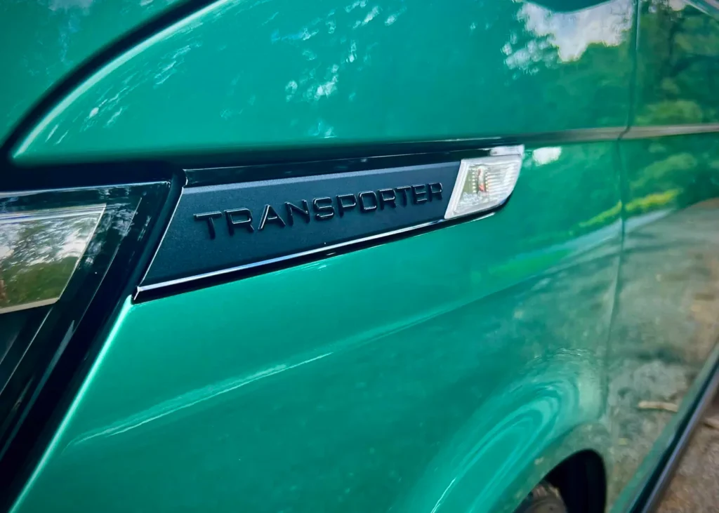 Transporter badge close-up on mint van