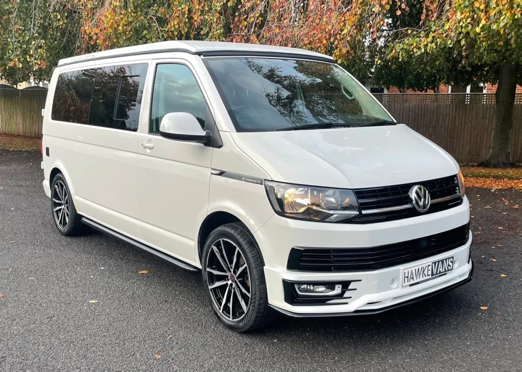 White VW camper van front and side view