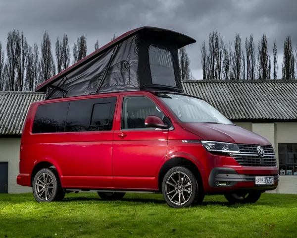 Red camper van with raised roof