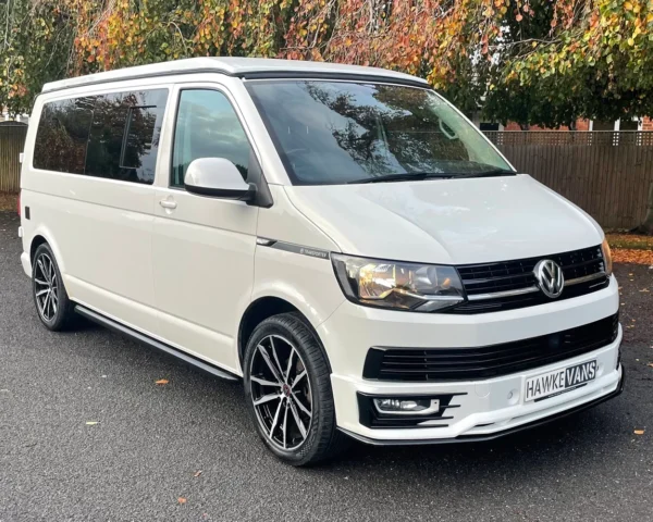 White VW camper van front and side view